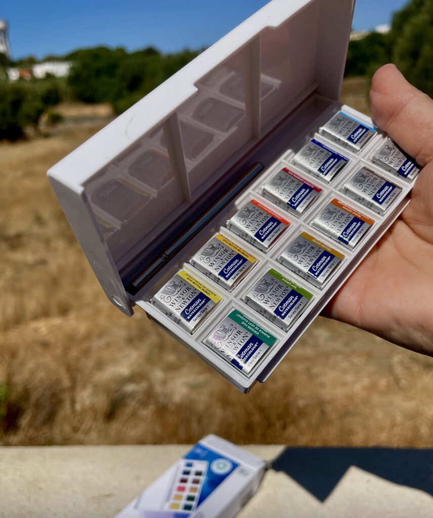 Winsor & Newton Travel Watercolor Set – On the Road Compact Winsor & Newton watercolor travel set with brush, used for plein air painting in Portugal.