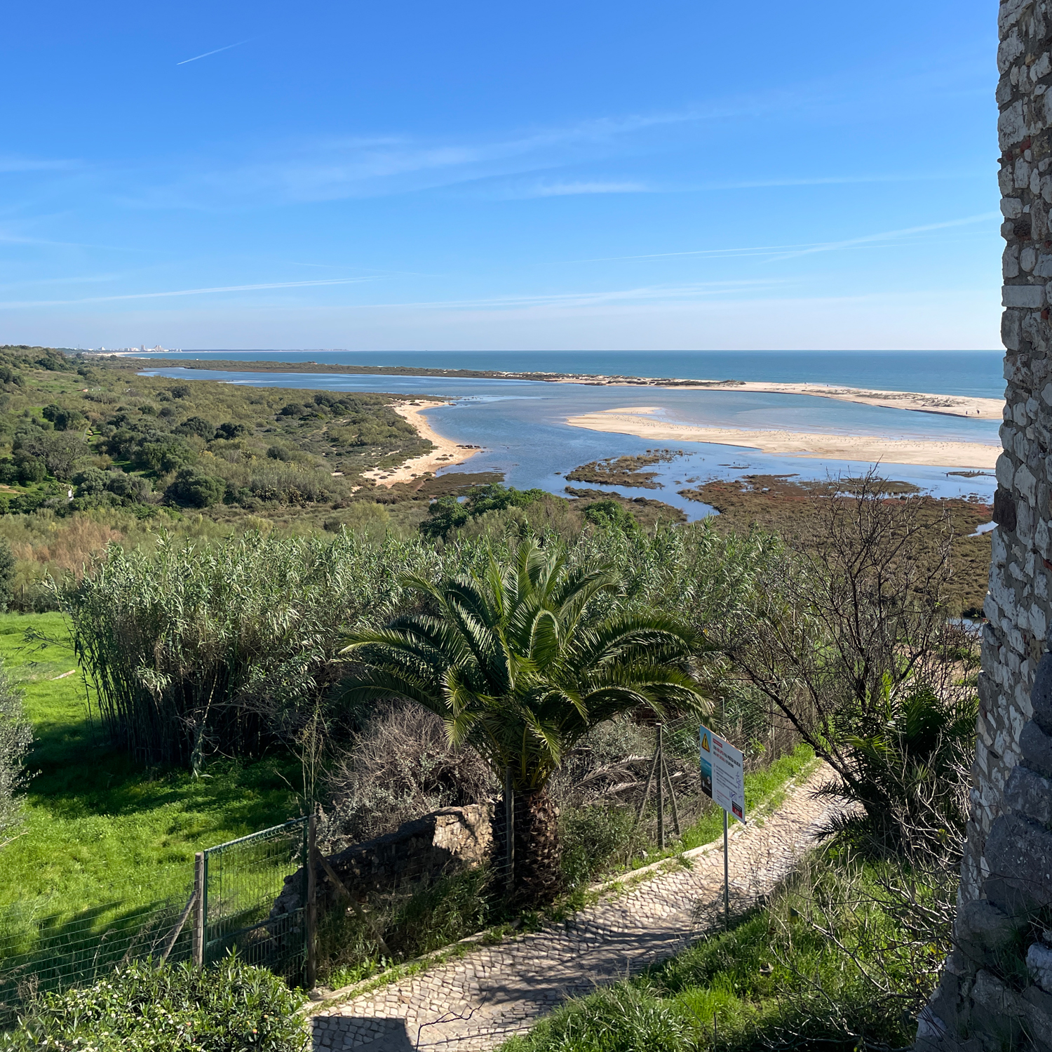 East Algarve View from Cacela Velha – Overlooking the Ria Formosa Lagoon Photo taken from the old village walls of Cacela Velha, showing the Ria Formosa lagoon and barrier islands in the distance.