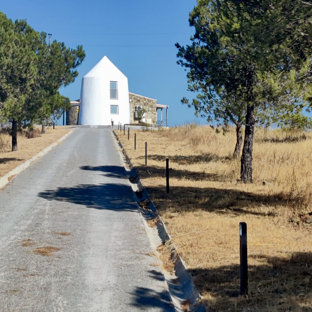 Moinho da Pateira – Hilltop Windmill on the Guadiana Trail Photo of the Moinho da Pateira, a traditional windmill standing alone on a hilltop in the Guadiana valley.