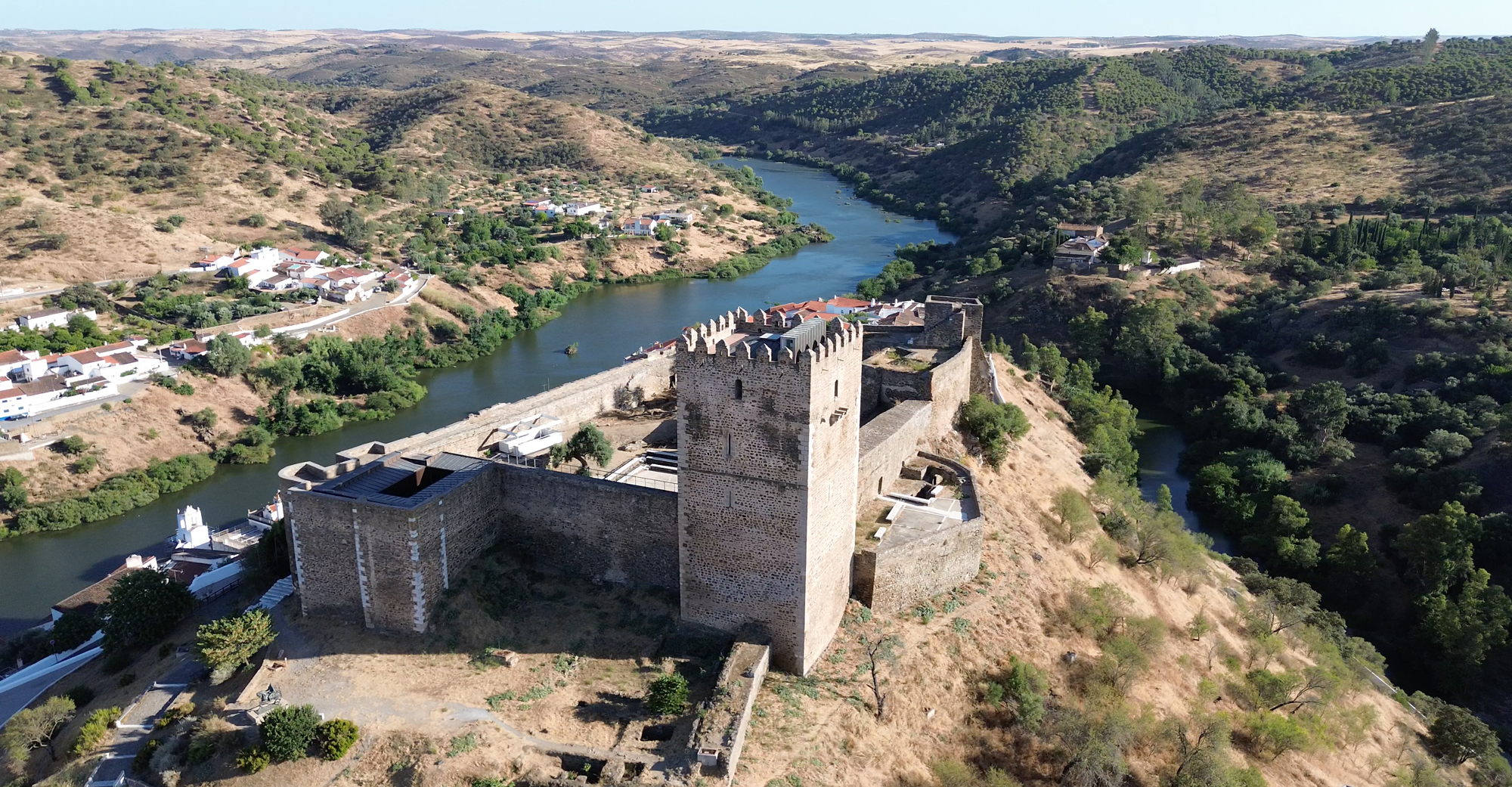 Mértola Castle Overlooking the Guadiana River Photo of Mértola Castle with the Guadiana River and surrounding Alentejo landscape in view.