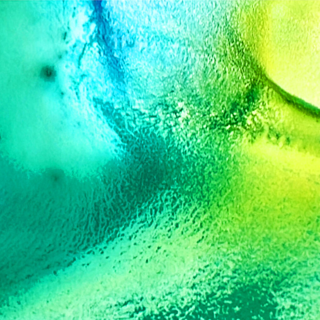 Close-up of a watercolor palette with half-mixed colours, showing the painting process for the Watercolour Winter Weekends course.