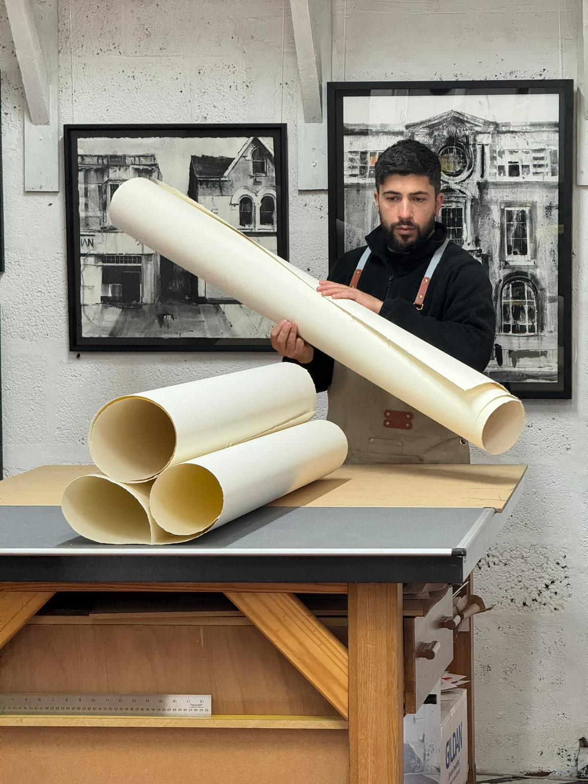 Grażyna Ostrowska holding one of her large Algarve-inspired paintings, introducing herself as the host of Lighthouse Artcourses.